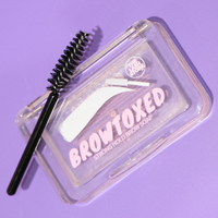 Browtoxed strong hold brow soap with brush on a purple background