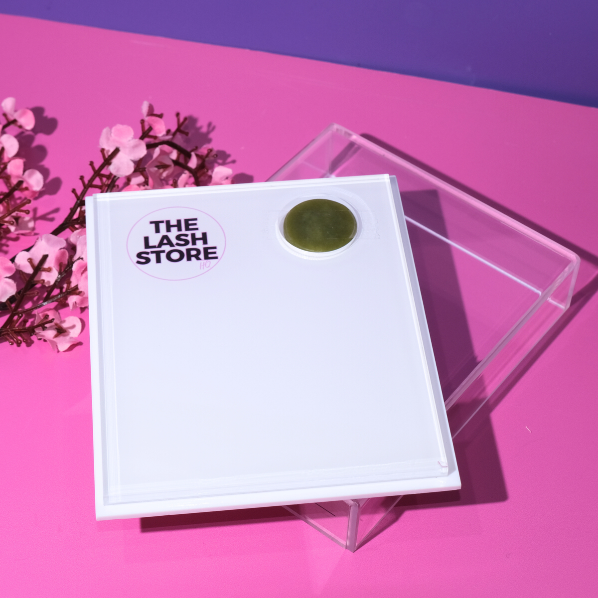 Product packaging with 'The Lash Store' branding on a pink background